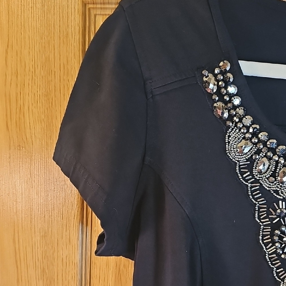 Chic Black Mini Dress with Embellished Neckline - Picture 4 of 10
